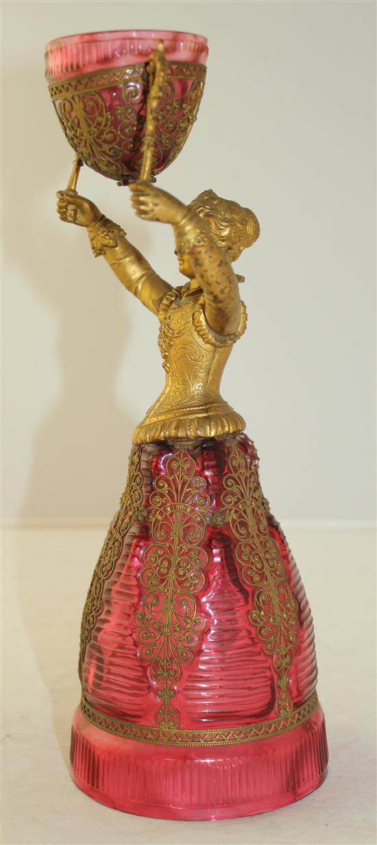 A German ruby glass and gilt metal figural marriage cup, probably Fritz Heckert, late 19th century, 26.5cm